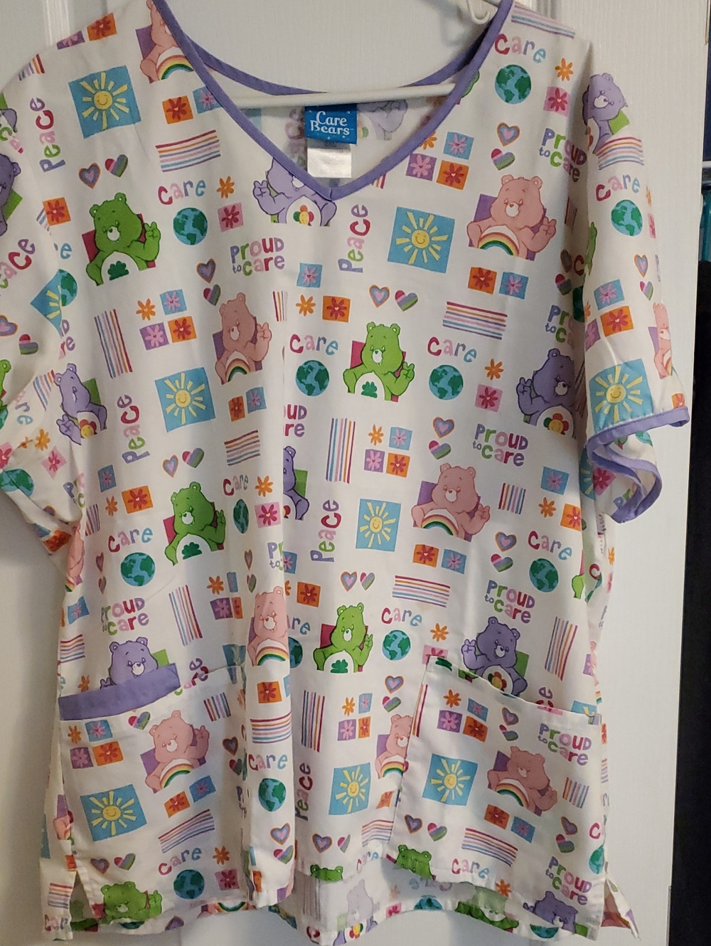 Care Bears Women Scrub Top with Pink, Purple, Green & Blue Accents